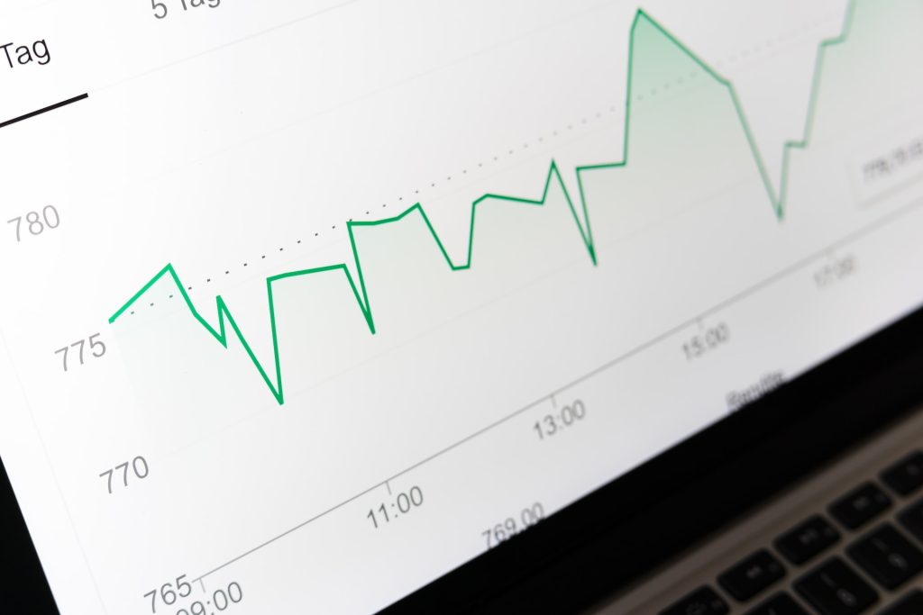 Laptop screen showing graph going up and down