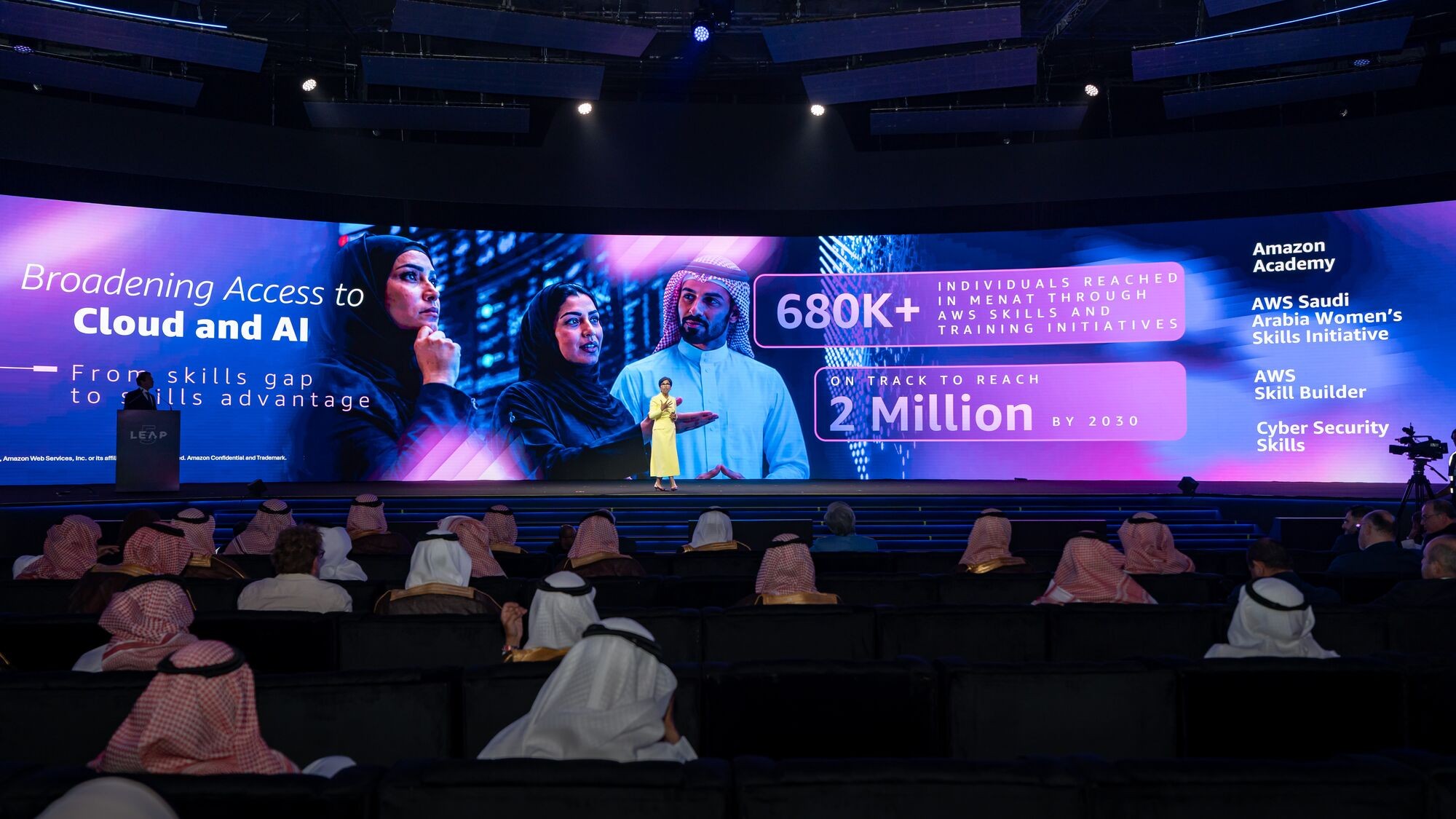AWS on stage at LEAP 2026 in Riyadh, with a screen showing Broadening Access to Cloud and AI, 680K+ individuals reached in MENAT and on track to reach 2 million by 2030