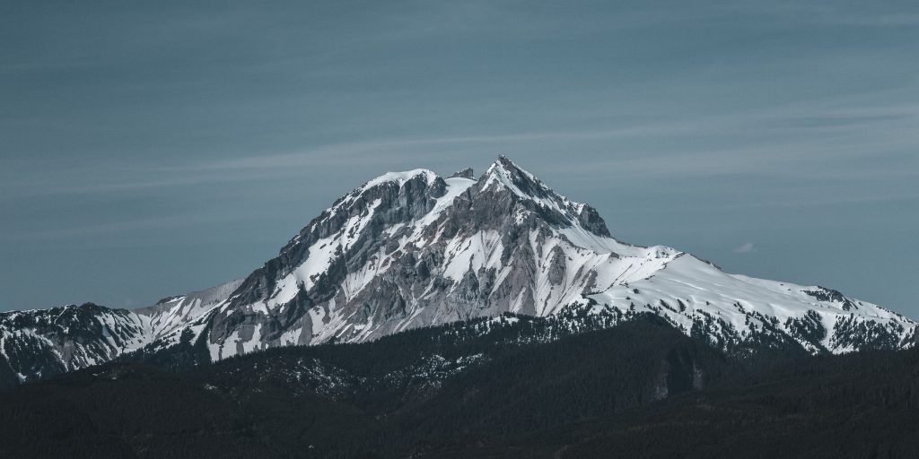 snow covered mountain under blue sky during daytime