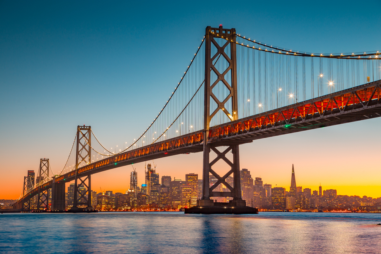 San Francisco skyline with Oakland Bay Bridge at sunset, California, USA