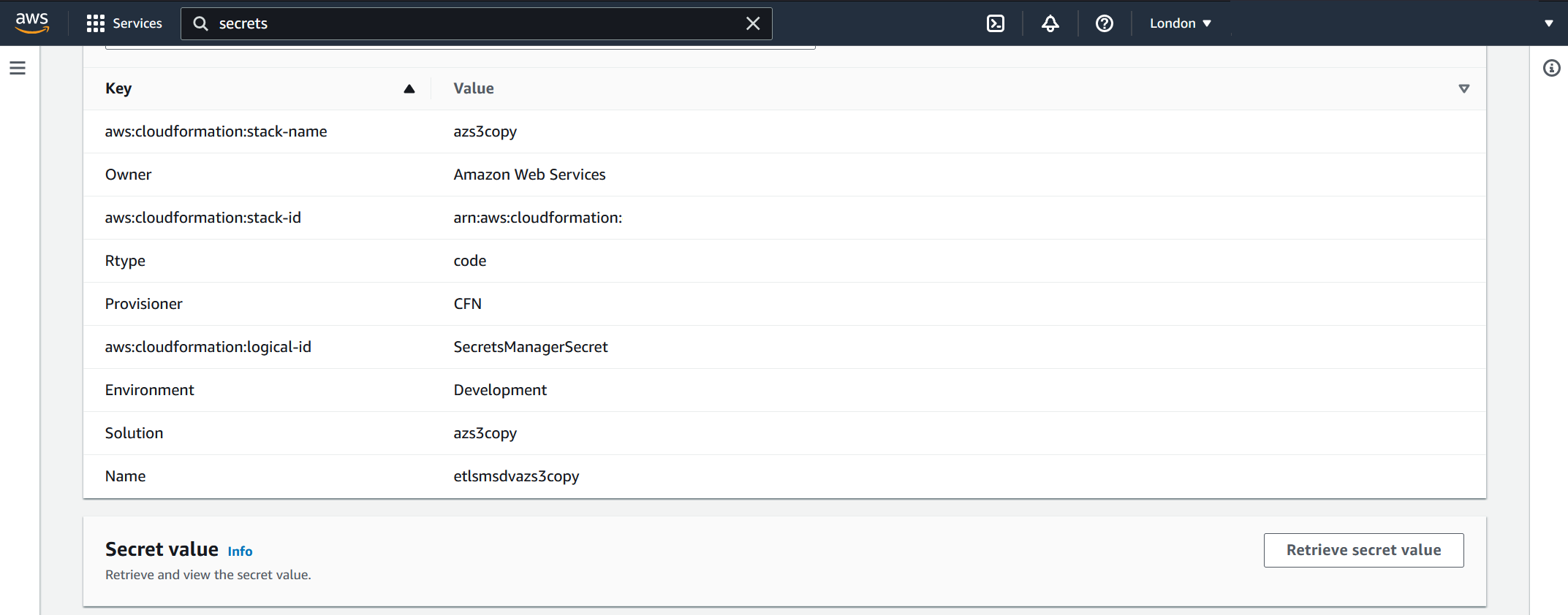 Screenshot showing AWS Secrets Manager retrieve secret button location