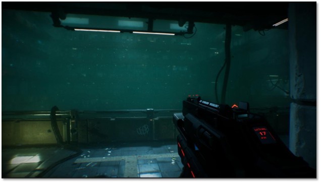 First-person view from DEFECT showing a futuristic weapon with red illuminated sights aimed down a flooded, deteriorating corridor with teal-green water and hanging fluorescent lights.