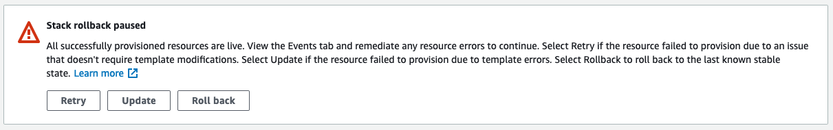 The Stack rollback paused message says that all successfully provisioned resources are live. The console displays Retry, Update, and Roll back buttons.