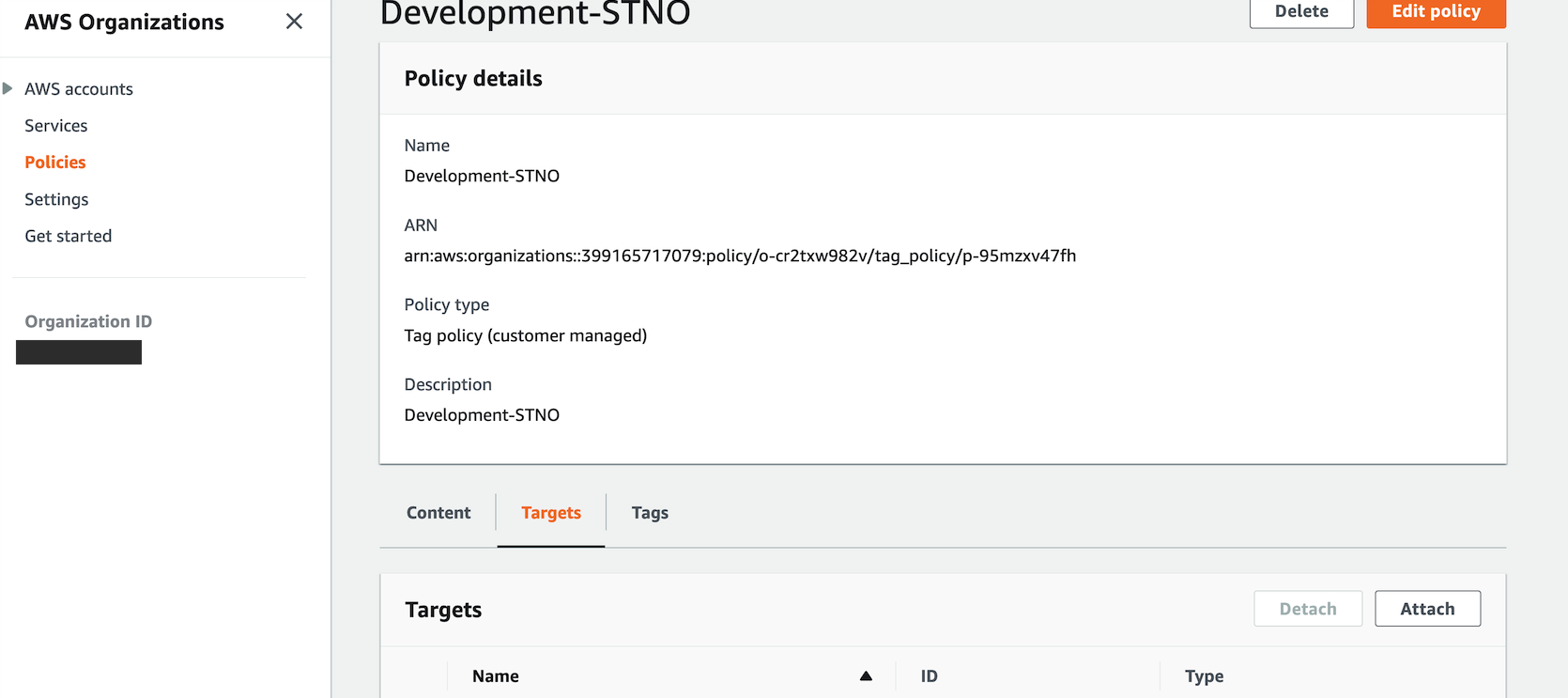 Demonstration of attaching the tag policy to Development OU by choosing Targets tab of the Development-STNO policy, and choosing Attach.