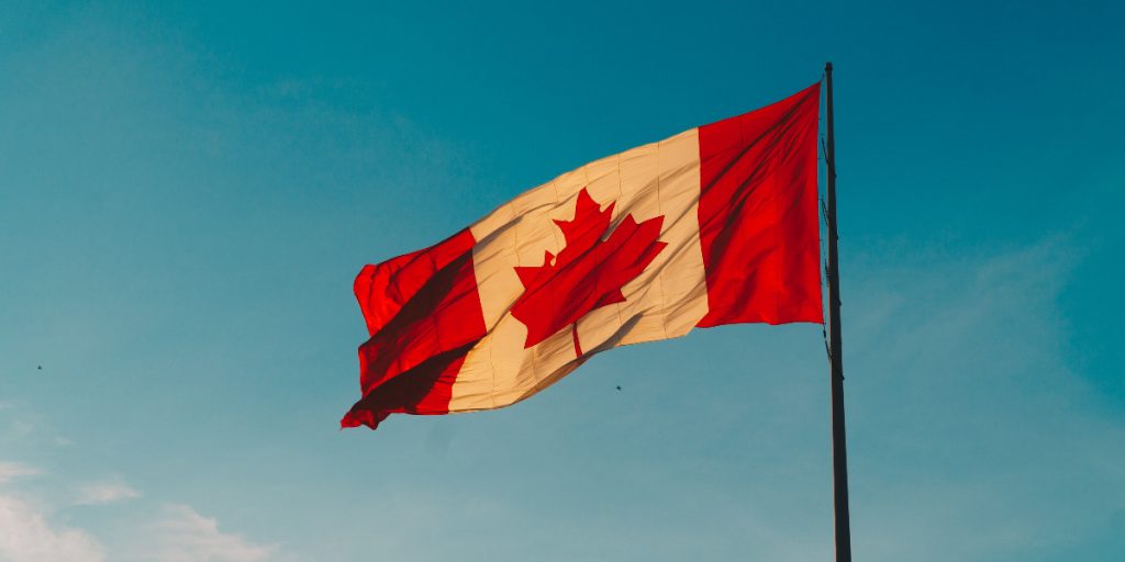 Canada flag outside waving in wind