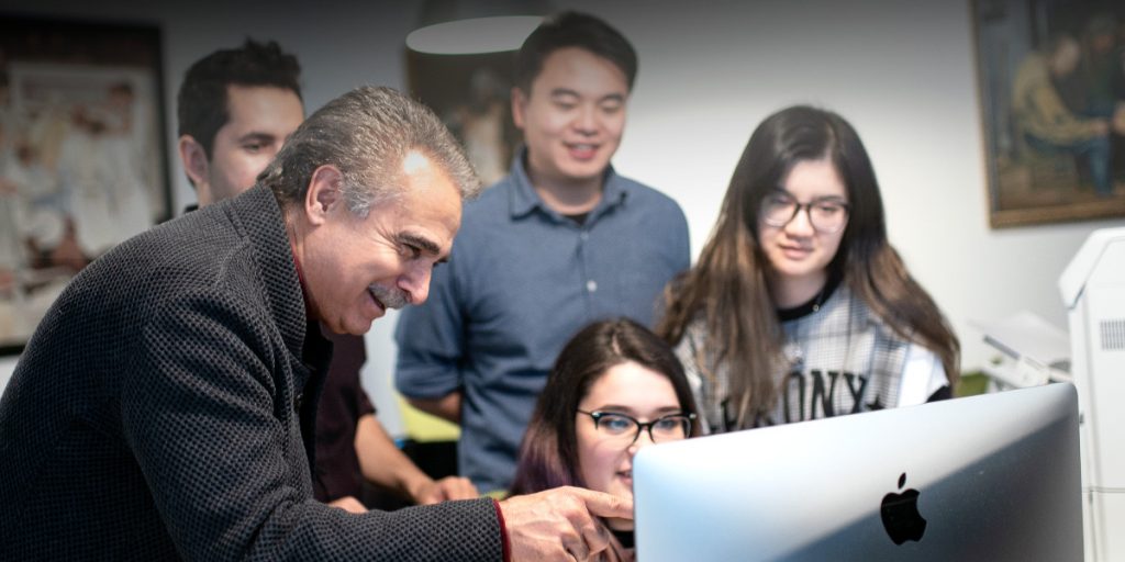 CyberPatient’s founder, Dr. Qayumi, teaches students on computer