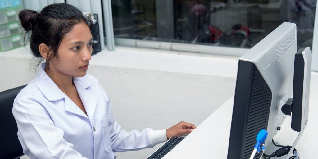 woman researcher at computer in lab