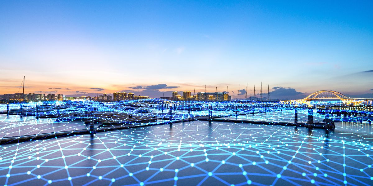 connected blue dots over a body of water bridges and city