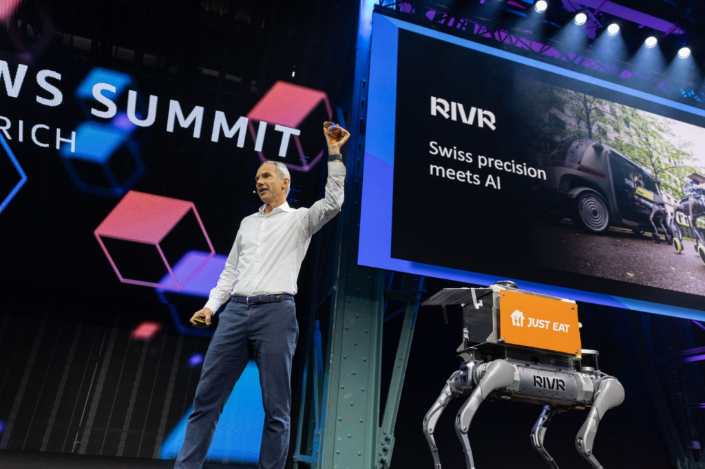 Chris Keller (Managing Director, Europe Central @AWS) demonstrating how the RIVR robot Milo delivers food to customers.
