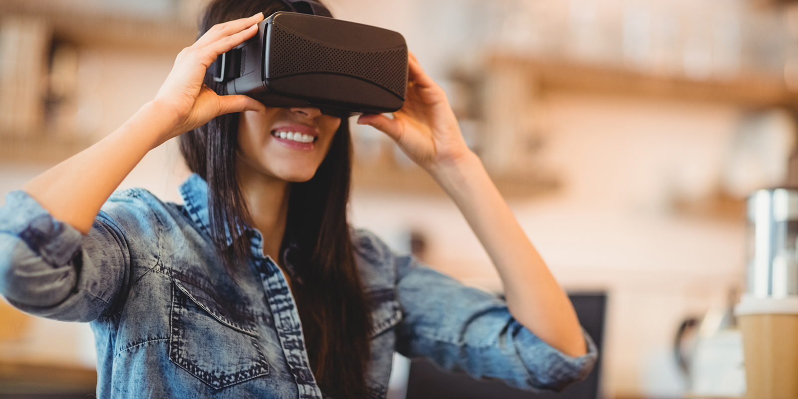 Young woman using the virtual reality headset