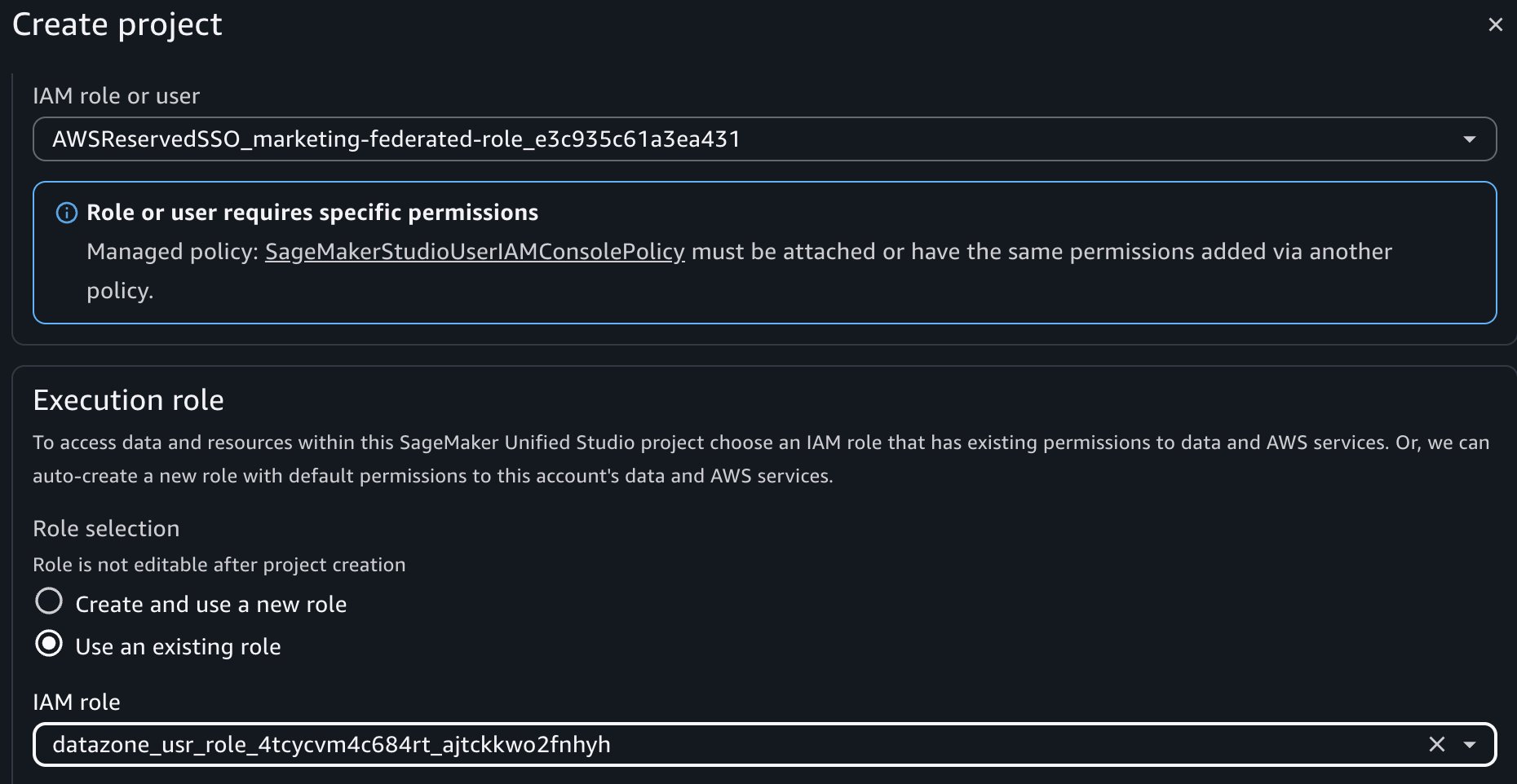 Amazon SageMaker Unified Studio Create project dialog showing IAM role configuration with AWSReservedSSO_marketing-federated-role selected, blue alert requiring SageMakerStudioUserIAMConsolePolicy attachment, Execution role section with "Use an existing role" option selected, and datazone_usr_role_4tcycvm4c684rt_ajtckkwo2fnhyh IAM role specified with note that role is not editable after project creation