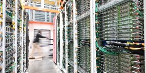 photo of AWS data center with a person moving in the background.