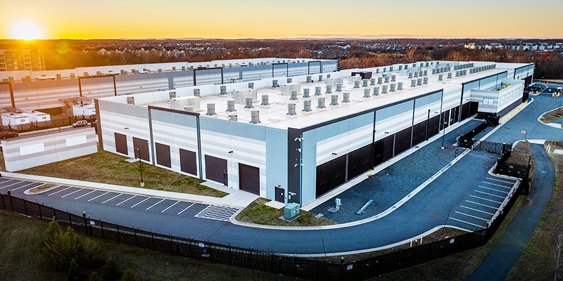 large building without windows at sunset