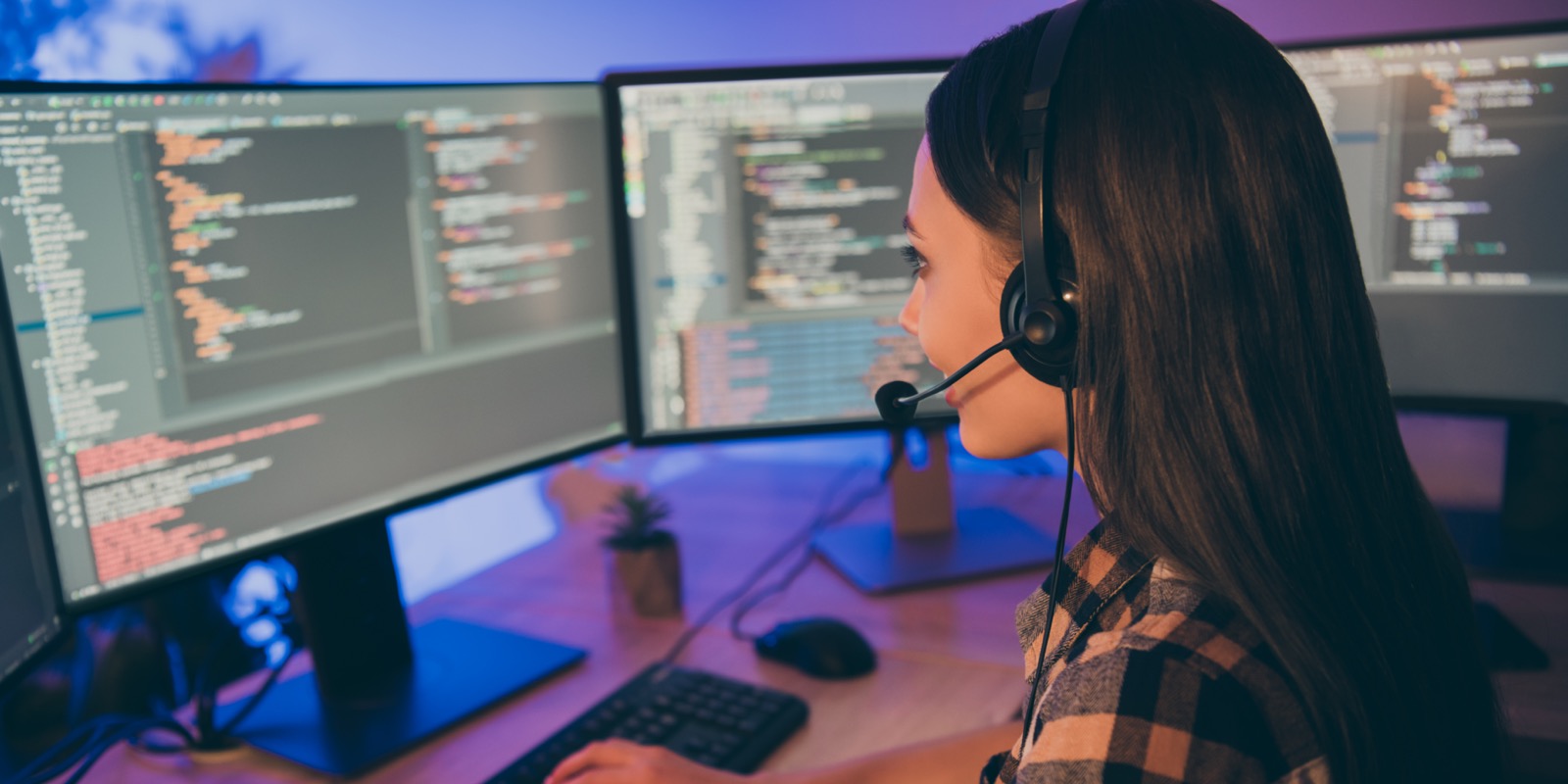 Close up photo of smiling joyful cheerful girl working as the head of software develpment department consulting the other workers