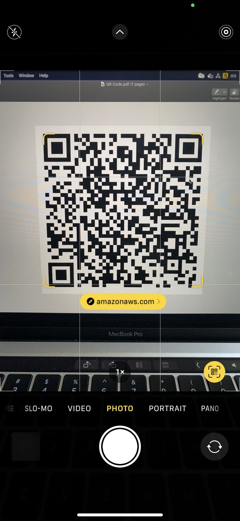 Image of mobile phone scanning QR code.