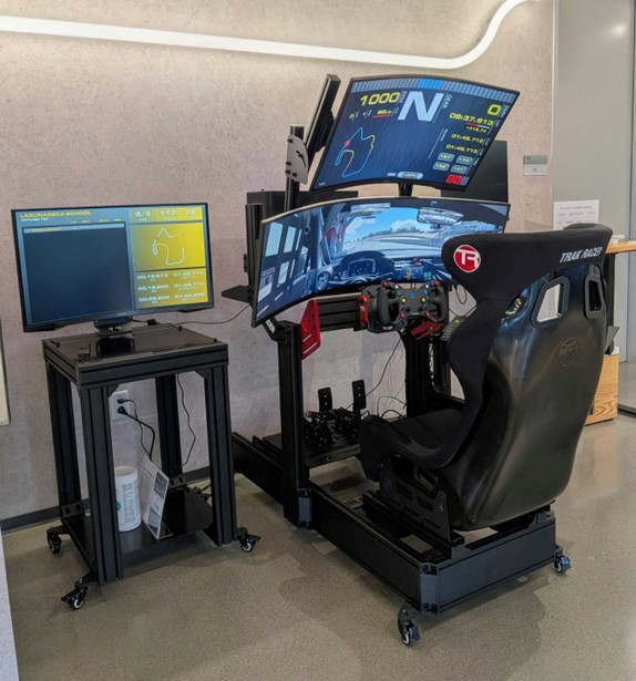 Picture of AWS and Sibros Race Car Simulator.