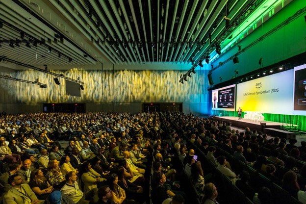 photo of AWS Life Sciences Symposium crowd and stage