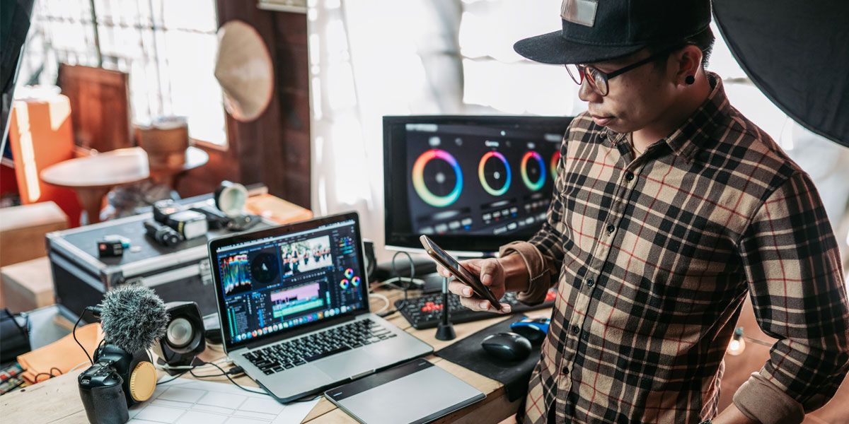 Video editor in front of work station coordinating final sending