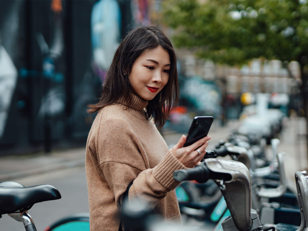 Asian woman using mobile app