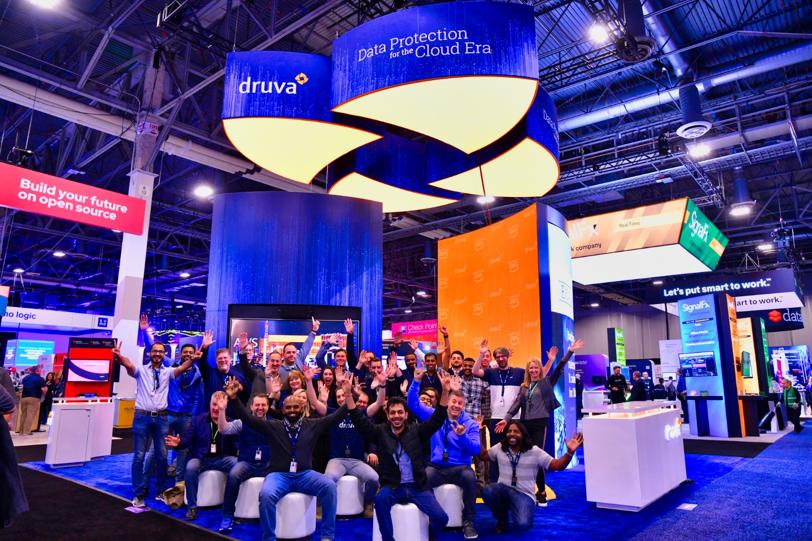 Full sized image of the Druva team at reinvent 2019 under their booth