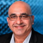 Headshot on blue checked background of Purple Ant founder