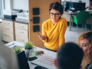 Woman explaining to her team