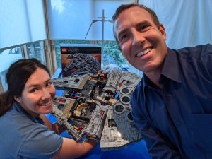 Larry building Legos with his family