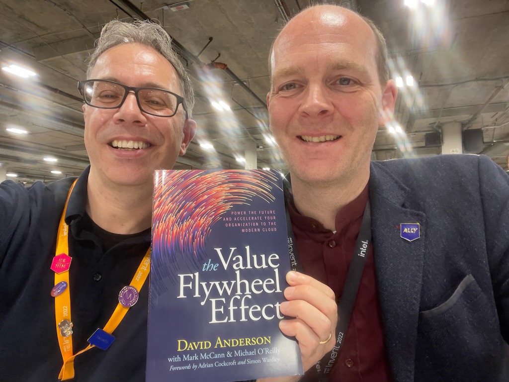 News Blog author Danilo Poccia holds a copy of The Value FlyWheel Effect, with the book's author David Anderson standing to his right.