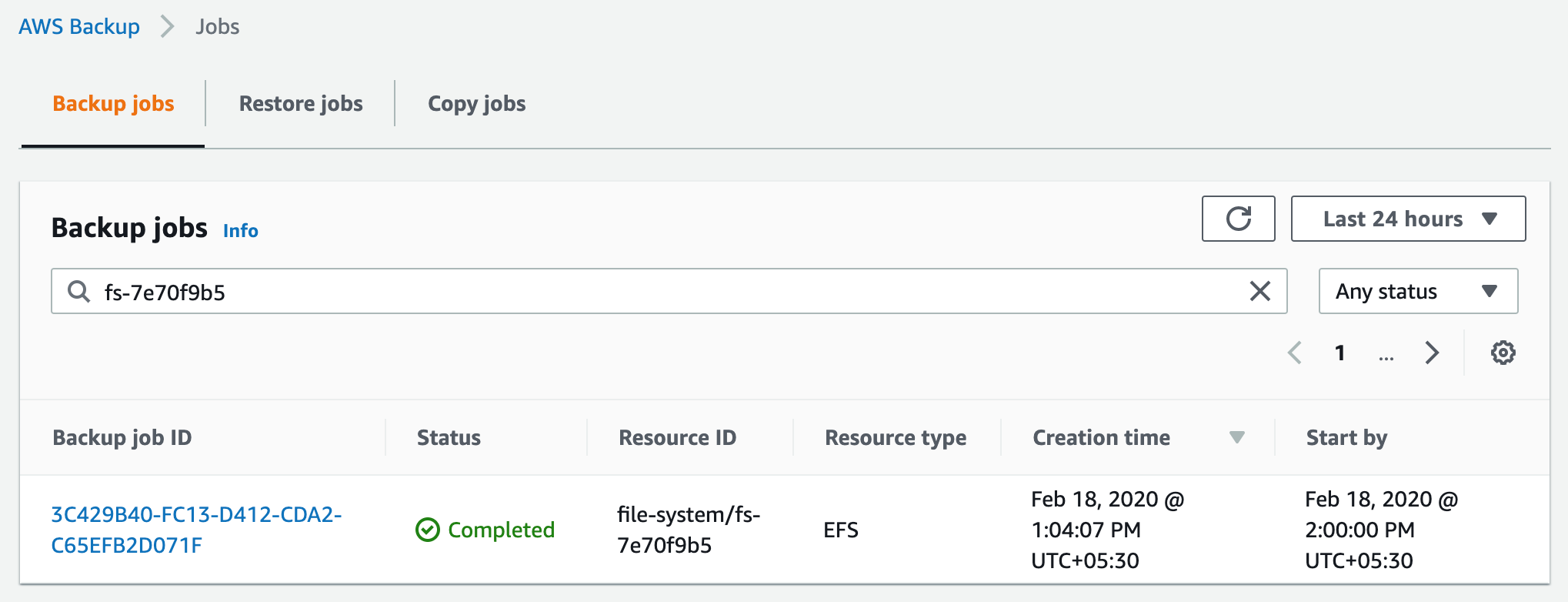 In this example scenario, the EFS file system (fs-7e70f9b5) has been backed up using AWS Backup as shown in the following screenshot