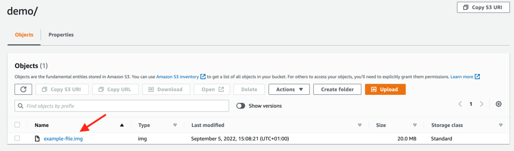 Amazon S3 Console showing a red arrow pointing to object newly uploaded.