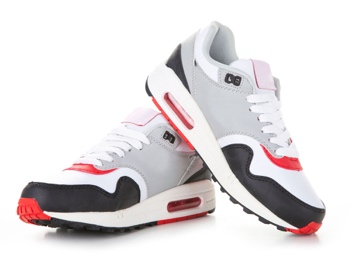 Pair of modern athletic running shoes displayed from multiple angles featuring white, gray, black, and red color scheme with visible air cushioning technology on white background