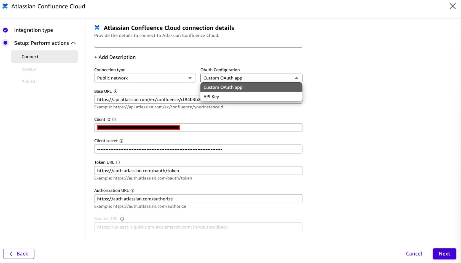 Screenshot of the 'Atlassian Confluence Cloud connection details' setup dialog in Amazon Quick. The form shows Connection type: 'Public network', OAuth Configuration dropdown set to 'Custom OAuth app' (with a dropdown showing 'Custom OAuth app' and 'API Key' options), a Base URL field (partially redacted), Client ID (redacted, highlighted with red border), Client secret (masked), Token URL (https://auth.atlassian.com/oauth/token), and Authorization URL (https://auth.atlassian.com/authorize). Navigation buttons Back and Next are visible at the bottom. This image shows how to configure custom OAuth credentials when setting up a Confluence Cloud connector in Amazon Quick.