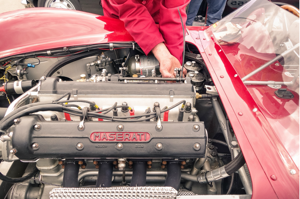 Mechanic working on race car engine