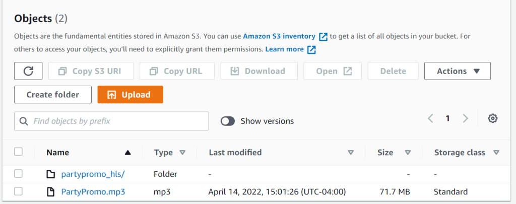 Within a S3 bucket, displaying the Objects tab. The objects shown are the source file and empty folder that will contain outputted HLS files from MediaConvert. 