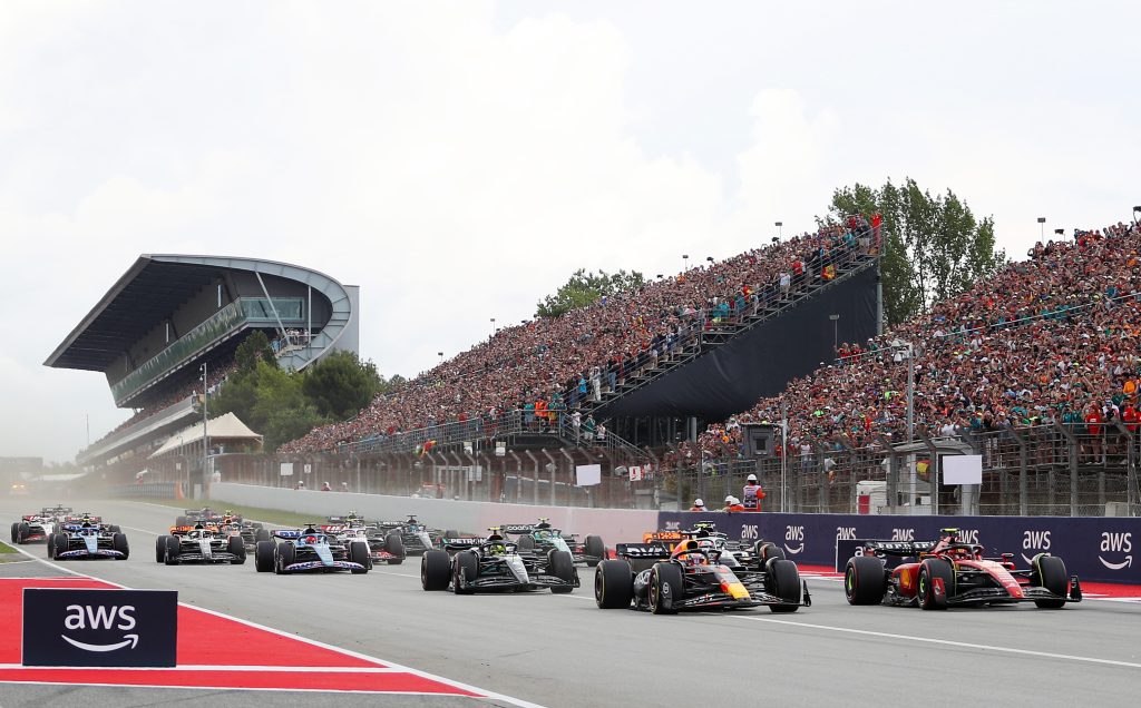 Max Verstappen, Oracle Red Bull Racing #1, leads Carlos Sainz Jr, Ferrari #55, and the rest of the field into turn one at the start of the Formula 1 AWS Gran Premio de Espana at Circuit de Barcelona-Catalunya on 4 June 2023. Credit: Getty Images.