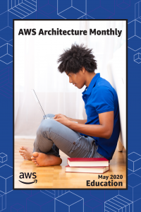 Young man sitting on a stack of books with his laptop